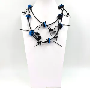 Extra long neoprene necklace with discs and strands